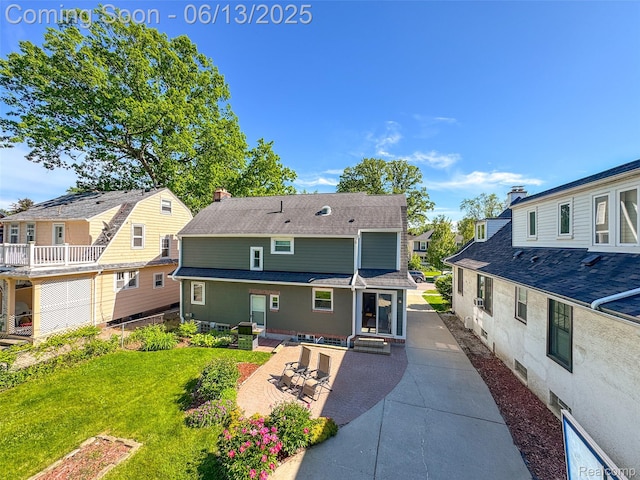 1630 W Houstonia Ave, Royal Oak, MI 48073 - back of house featuring a residential view, a patio area, roof with shingles, and a lawn
