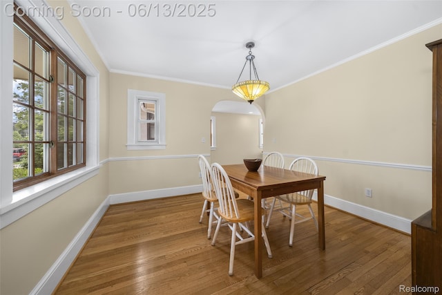 1630 W Houstonia Ave, Royal Oak, MI 48073 - dining area with baseboards, arched walkways, wood-type flooring, and ornamental molding