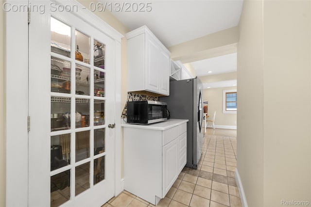 1630 W Houstonia Ave, Royal Oak, MI 48073 - kitchen featuring stainless steel refrigerator with ice dispenser, light tile patterned floors, white cabinetry, light countertops, and recessed lighting
