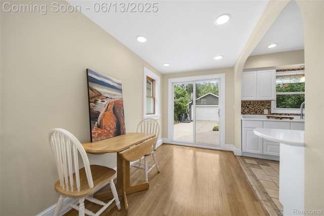 1630 W Houstonia Ave, Royal Oak, MI 48073 - dining area featuring plenty of natural light, baseboards, recessed lighting, light wood-style flooring, and arched walkways