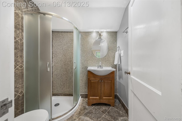 1630 W Houstonia Ave, Royal Oak, MI 48073 - bathroom featuring vanity, a stall shower, tile walls, tile patterned floors, and toilet