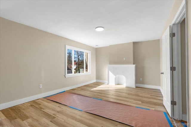 16558 Indiana St, Detroit, MI 48221 - unfurnished living room with wood finished floors and baseboards