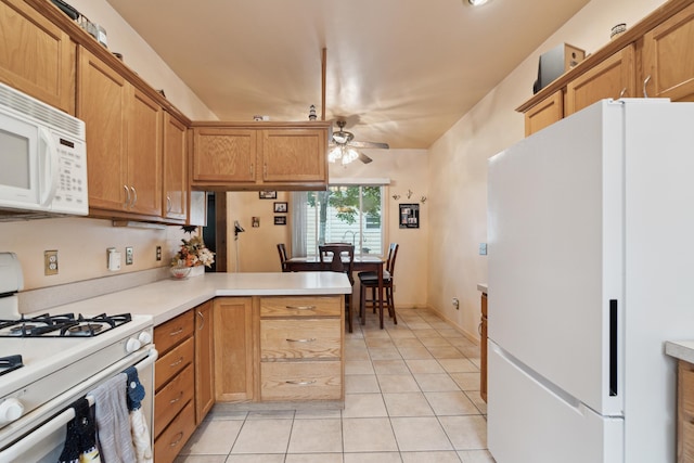 1704 Pringle Ave, Jackson, MI 49203 - kitchen featuring white appliances, ceiling fan, light tile patterned flooring, and light countertops