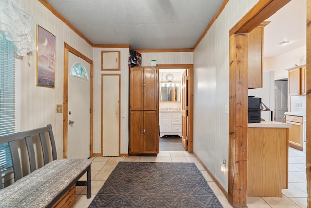 1704 Pringle Ave, Jackson, MI 49203 - entrance foyer with light tile patterned floors, crown molding, a textured ceiling, and wooden walls