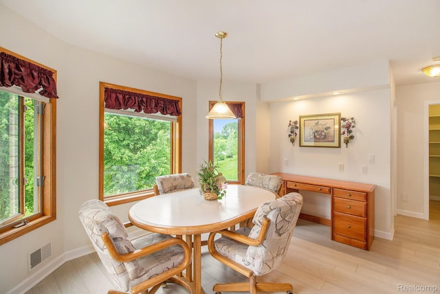 6443 Baldwin Rd, Swartz Creek, MI 48473 - dining area with light wood-type flooring and baseboards