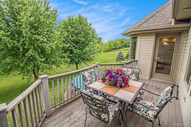 6443 Baldwin Rd, Swartz Creek, MI 48473 - deck featuring a lawn and outdoor dining area