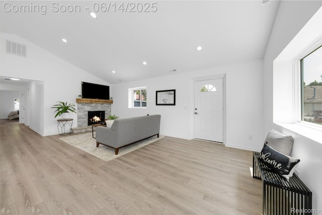 2694 Vendome Ave, Rochester Hills, MI 48309 - living area featuring recessed lighting, wood finished floors, a fireplace, and high vaulted ceiling