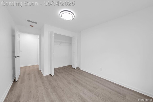 2694 Vendome Ave, Rochester Hills, MI 48309 - unfurnished bedroom with wood finished floors and a closet