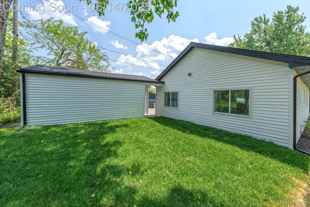 2694 Vendome Ave, Rochester Hills, MI 48309 - rear view of property with a yard and an outbuilding