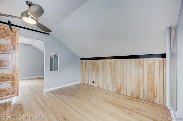 263 E Woodland St, Ferndale, MI 48220 - bonus room with vaulted ceiling, wood finished floors, a barn door, and a ceiling fan
