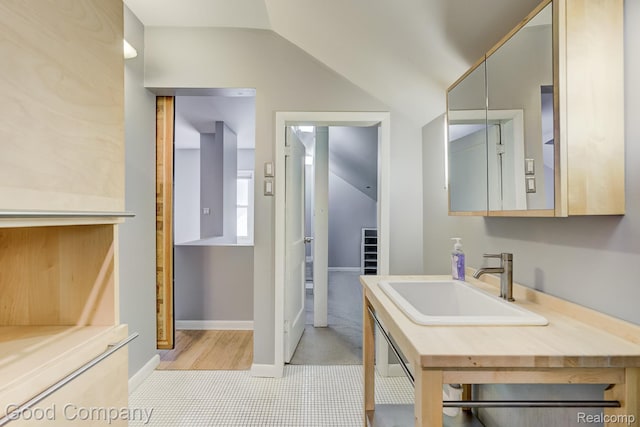 263 E Woodland St, Ferndale, MI 48220 - bathroom featuring lofted ceiling and vanity