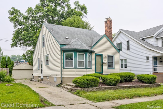 263 E Woodland St, Ferndale, MI 48220 - bungalow-style home with a garage and an outdoor structure