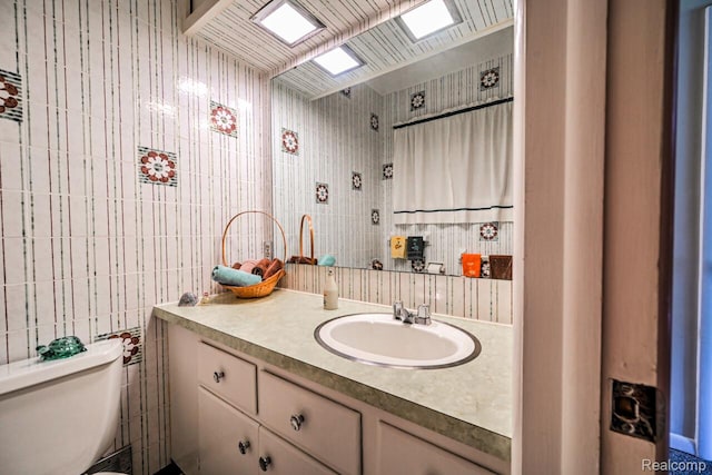 23880 Glencreek Dr, Farmington Hills, MI 48336 - bathroom featuring vanity and tile walls