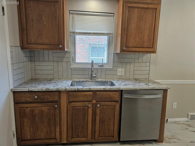 9311 Dixie, Redford, MI 48239 - kitchen with stainless steel dishwasher, light marble finish flooring, tasteful backsplash, and light stone countertops
