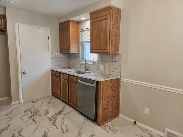 9311 Dixie, Redford, MI 48239 - kitchen with dishwasher, light marble finish flooring, and brown cabinets