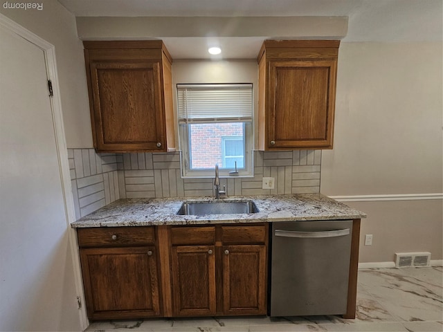 9311 Dixie, Redford, MI 48239 - kitchen featuring dishwasher, light marble finish flooring, light stone counters, and decorative backsplash