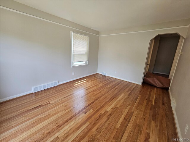 9311 Dixie, Redford, MI 48239 - unfurnished room featuring wood finished floors and arched walkways