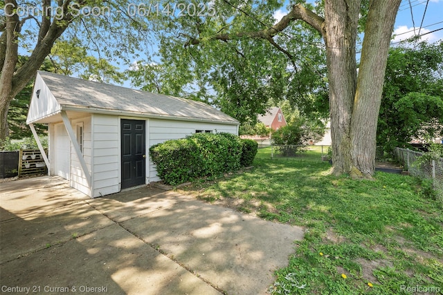 3156 Edgewood St, Dearborn, MI 48124 - view of yard featuring concrete driveway, an outdoor structure, and a detached garage