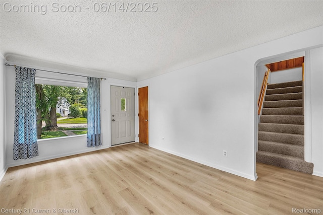 3156 Edgewood St, Dearborn, MI 48124 - entrance foyer with stairway, a textured ceiling, and wood finished floors