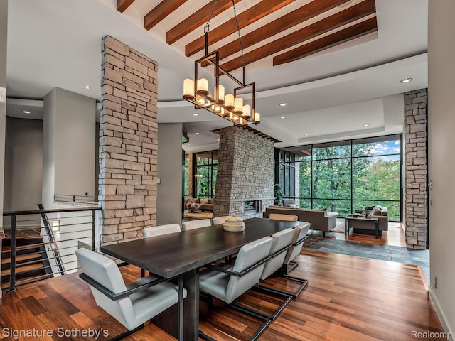 6956 Cooley Lake Rd, White Lake, MI 48383 - dining area featuring a towering ceiling, plenty of natural light, wood finished floors, recessed lighting, and beamed ceiling