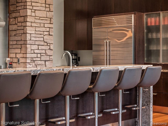 6956 Cooley Lake Rd, White Lake, MI 48383 - indoor bar featuring stainless steel built in fridge