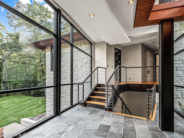 6956 Cooley Lake Rd, White Lake, MI 48383 - staircase featuring recessed lighting and stone finish flooring