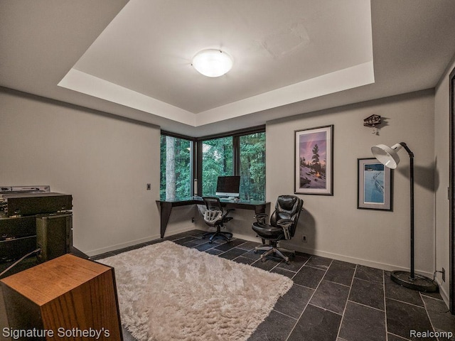 6956 Cooley Lake Rd, White Lake, MI 48383 - office space featuring a raised ceiling, baseboards, and dark tile patterned floors