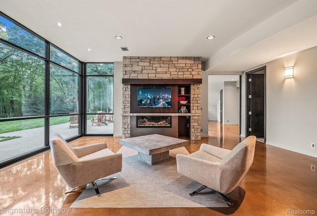 6956 Cooley Lake Rd, White Lake, MI 48383 - living area featuring a fireplace, floor to ceiling windows, and recessed lighting