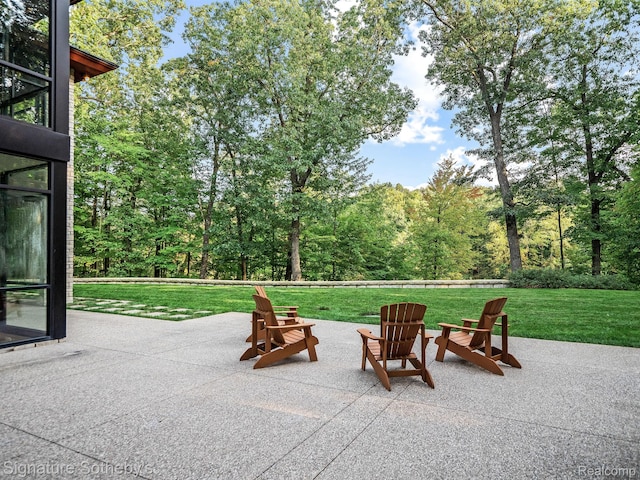 6956 Cooley Lake Rd, White Lake, MI 48383 - view of patio featuring a fire pit