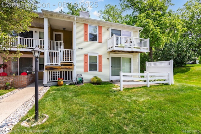 2024 Hamilton Rd Unit 6, Okemos, MI 48864 - view of property with a chimney and a balcony