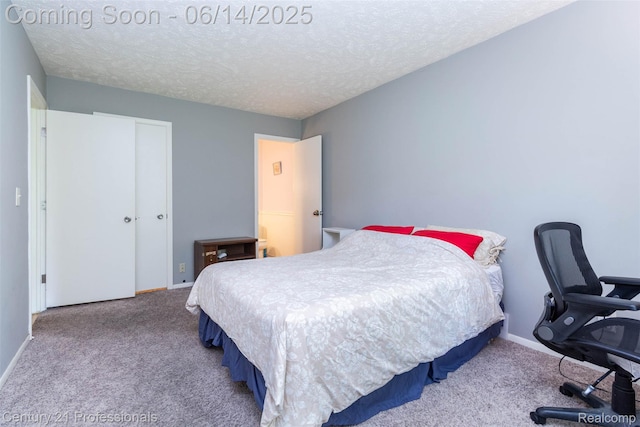 2024 Hamilton Rd Unit 6, Okemos, MI 48864 - bedroom with carpet, baseboards, a textured ceiling, and a closet