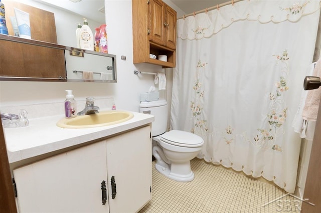 2312 Bay Ridge Dr, Au Gres, MI 48703 - full bathroom featuring toilet, vanity, tile patterned floors, and a shower with shower curtain