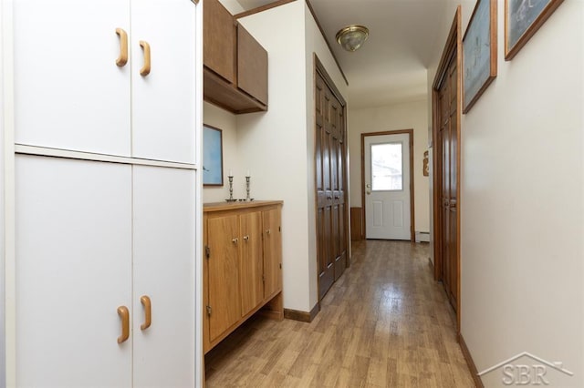 2312 Bay Ridge Dr, Au Gres, MI 48703 - corridor with light wood-type flooring and baseboards
