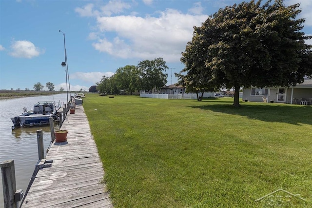 2312 Bay Ridge Dr, Au Gres, MI 48703 - dock with a water view and a yard