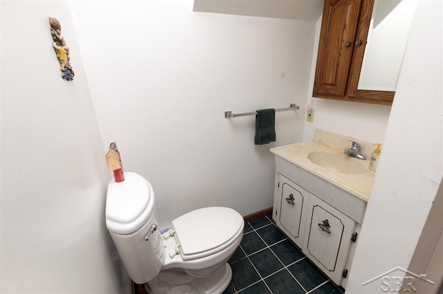2312 Bay Ridge Dr, Au Gres, MI 48703 - bathroom featuring vanity, toilet, tile patterned flooring, and baseboards