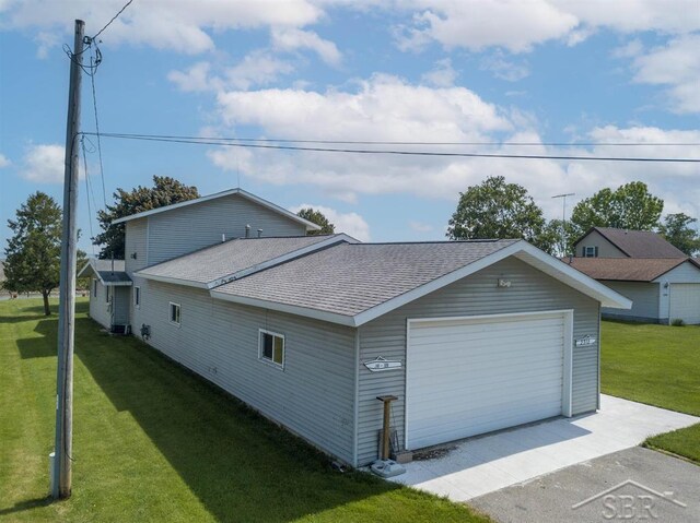 2312 Bay Ridge Dr, Au Gres, MI 48703 - view of side of property with roof with shingles and a yard