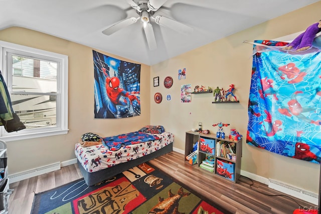 1028 Loren Rd, Adrian, MI 49221 - bedroom featuring wood finished floors, a baseboard radiator, ceiling fan, baseboards, and vaulted ceiling