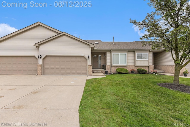 53242 Butternut St, Chesterfield, MI 48051 - view of front of property featuring brick siding, driveway, an attached garage, and a front lawn