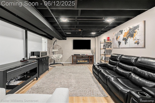 53242 Butternut St, Chesterfield, MI 48051 - living room featuring light wood-style floors and a glass covered fireplace