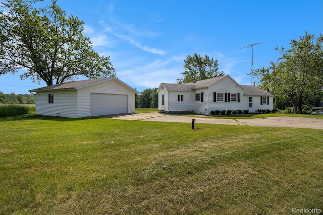 2651 Norvell Rd, Grass Lake, MI 49240 - single story home with an outbuilding, a detached garage, and a front lawn