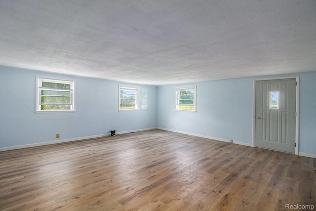 2651 Norvell Rd, Grass Lake, MI 49240 - spare room featuring wood finished floors and baseboards