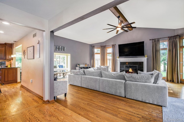 18704 Gary Ln, Livonia, MI 48152 - living area featuring light wood-style flooring, plenty of natural light, a tile fireplace, ceiling fan, and recessed lighting
