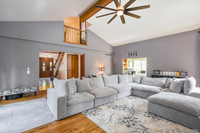 18704 Gary Ln, Livonia, MI 48152 - living room featuring wood finished floors, high vaulted ceiling, a ceiling fan, and beamed ceiling