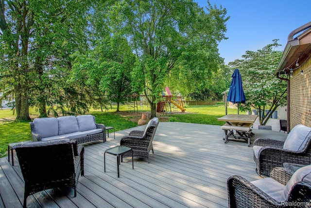 18704 Gary Ln, Livonia, MI 48152 - deck featuring an outdoor hangout area, a playground, and outdoor dining space