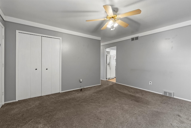 15356 Hampden St, Taylor, MI 48180 - unfurnished bedroom featuring carpet floors, white fridge with ice dispenser, a closet, and ceiling fan