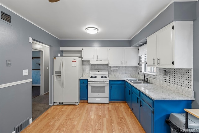 15356 Hampden St, Taylor, MI 48180 - kitchen featuring white appliances, blue cabinetry, under cabinet range hood, light wood-style flooring, and white cabinetry