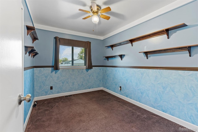 15356 Hampden St, Taylor, MI 48180 - spare room with dark colored carpet, a ceiling fan, and wallpapered walls