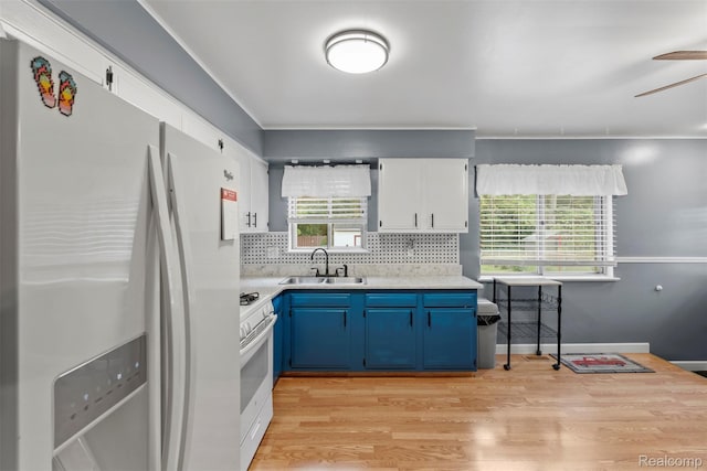 15356 Hampden St, Taylor, MI 48180 - kitchen featuring refrigerator with ice dispenser, blue cabinetry, white gas range, light countertops, and backsplash