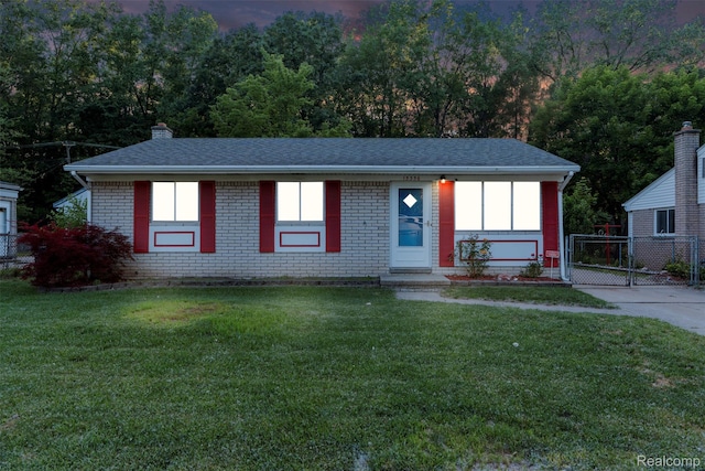 15356 Hampden St, Taylor, MI 48180 - view of front of home with brick siding, a chimney, a gate, and a shingled roof
