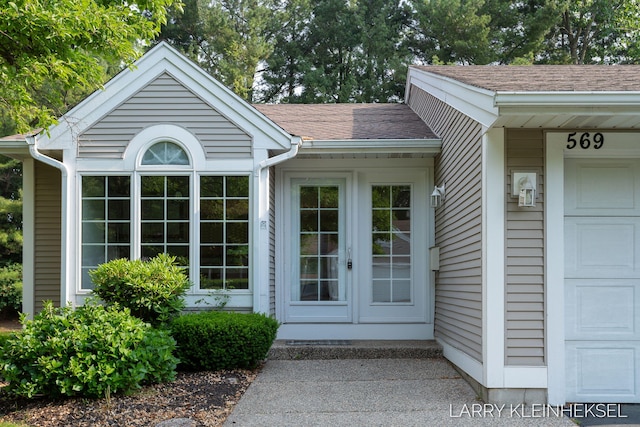 569 Appletree Dr, Holland, MI 49423 - property entrance with a shingled roof